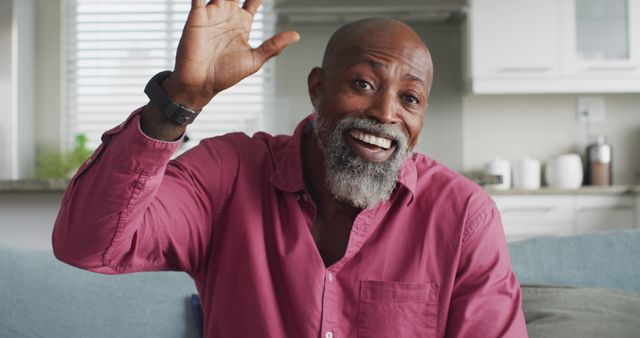 Image of happy african american man having image call. Leisure, relax and spending time at home with technology concept.