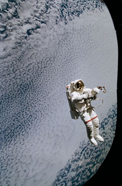 STS064-45-012 (16 Sept. 1994) --- Backdropped against a massive wall of white clouds 130 nautical miles below, astronaut Mark C. Lee floats freely as he tests the new Simplified Aid for EVA Rescue (SAFER) system. The image was exposed with a 35mm camera from the shirt-sleeve environment of the space shuttle Discovery. Astronauts Lee and Carl J. Meade took turns using the SAFER hardware during their shared Extravehicular Activity (EVA) on Sept. 16, 1994. The test of SAFER is the first phase of a larger SAFER program whose objectives are to establish a common set of requirements for both space shuttle and space station program needs, develop a flight demonstration of SAFER, validate system performance and, finally, develop a production version of SAFER for the shuttle and station programs. Photo credit: NASA