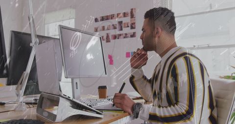 Businessman Analyzing Data with Digital Interface in Modern Office