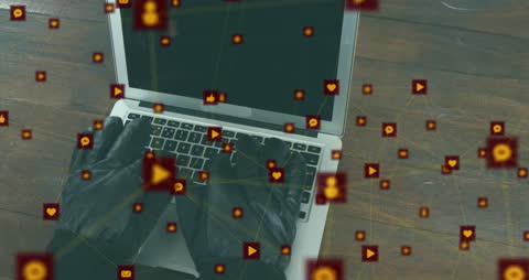 Anonymous Hacker in Gloves Accessing Laptop Network Data