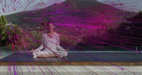 Meditating teen female sitting cross-legged on deck in white set with magenta overlay