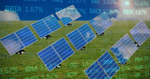Solar panels on grass with superimposed stock market data