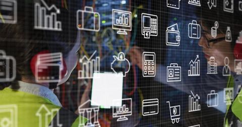 Server room workers analyzing digital interface data