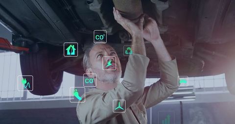 Mechanic inspecting car undercarriage with augmented reality diagnostics and emissions icons