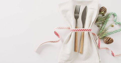 Festive Table Setting with Utensils and Christmas Decor - Download Free Stock Images Pikwizard.com