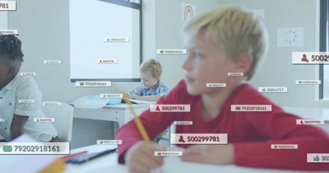 Elementary students writing in classroom with floating id label illustrating data tracking