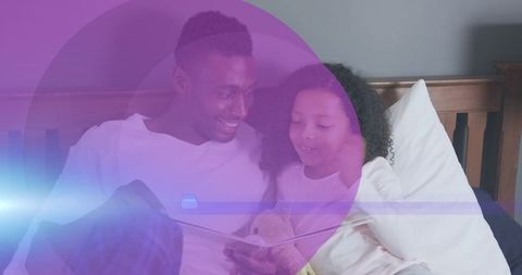 Father and Daughter Reading Together with Digital Overlay