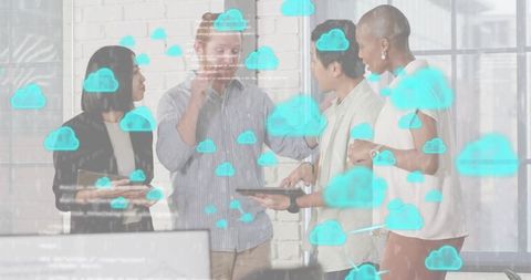 Team collaborating on cloud strategy using tablet in bright modern office