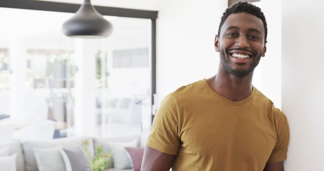 Smiling Man Standing in Modern Living Room - Download Free Stock Images Pikwizard.com