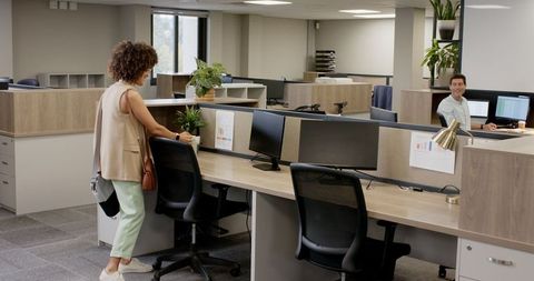 Diverse professionals engaging in open office environment
