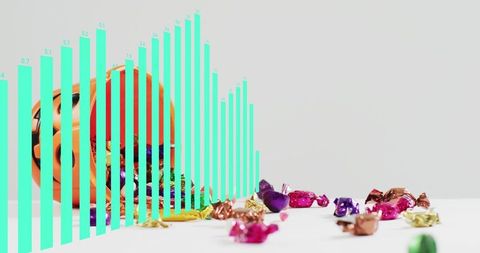 Spilling pumpkin bucket with colorful foil candies and turquoise graphic bars