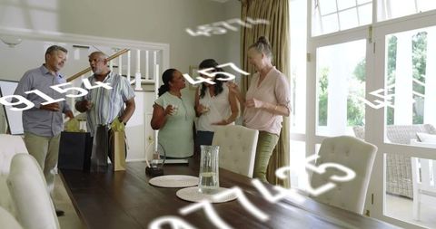 Multigenerational friends celebrating in bright dining room with gift bags and toasts