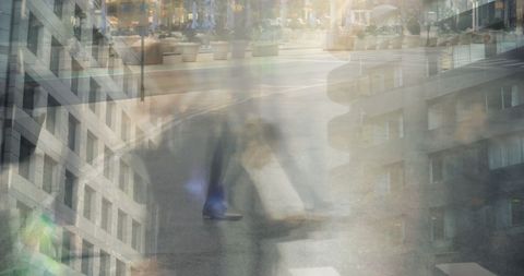 Blurred commuters crossing modern city intersection with layered architecture and motion