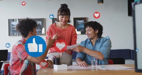 Diverse Team Collaborating on Social Media Concepts in Office