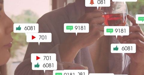 Couple clinking wine glasses at cafe with social media reaction bubbles for modern romance
