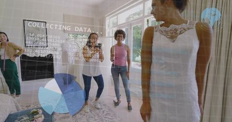 Bridal fitting at home with friends measuring dress while digital analytics overlay data