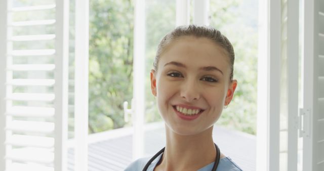 Smiling Nurse Standing in Bright Room - Download Free Stock Images Pikwizard.com