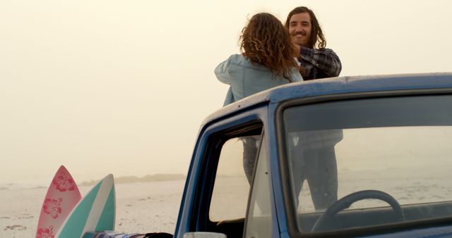 Couple Embracing by Vintage Pickup Truck at Beach Sunset - Download Free Stock Images Pikwizard.com