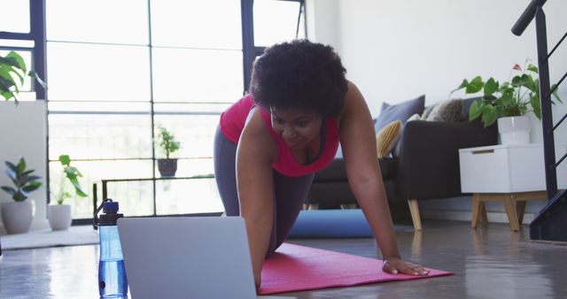 Woman Exercising at Home with Online Fitness Routine - Download Free Stock Images Pikwizard.com