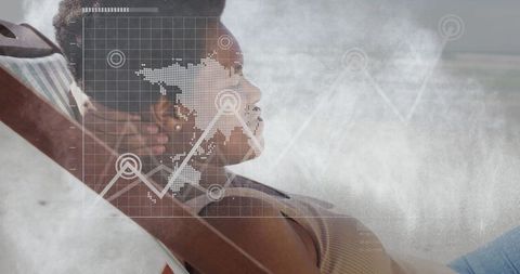 Relaxing on Beach with Digital Overlay of Global Data