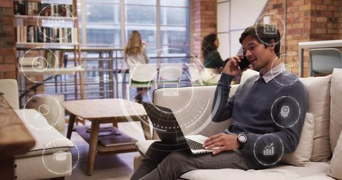 Professional man remote working on laptop in urban coworking space