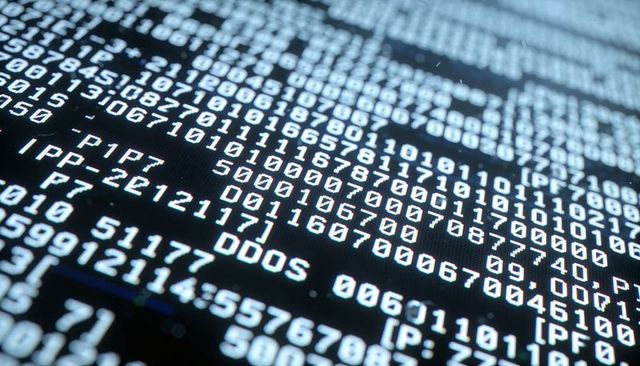 Glowing terminal code showing ddos log entries on server monitor for cyber threat