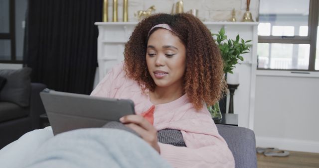 Content Woman Relaxing on Couch Using Tablet at Home - Download Free Stock Images Pikwizard.com