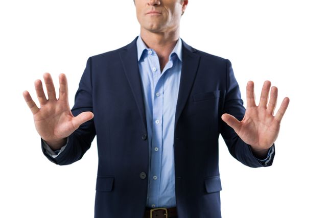 Businessman in a suit interacting with an invisible screen, representing modern technology and innovation. Ideal for use in business, technology, and corporate presentations, as well as marketing materials highlighting digital advancements and professional services.