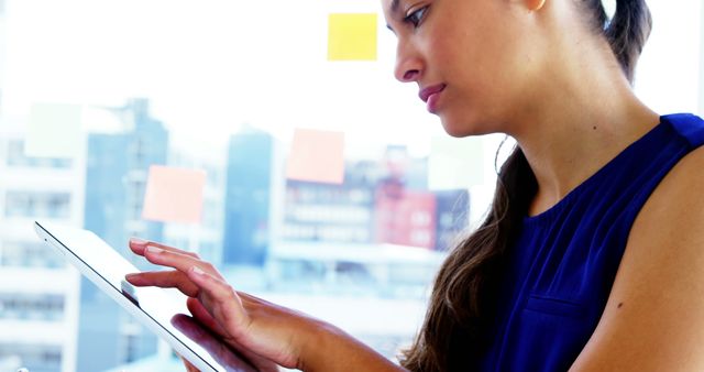 Young Woman Using Tablet at Office Desk - Download Free Stock Images Pikwizard.com