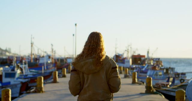 Person with Curly Hair Standing by Fishing Dock at Sunrise - Download Free Stock Images Pikwizard.com