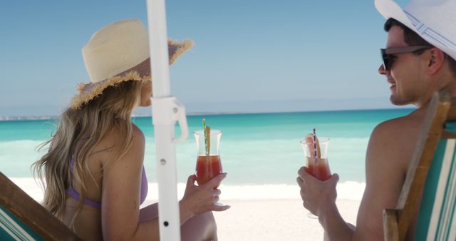 Couple Relaxing on Beach Chairs Holding Cocktails - Download Free Stock Images Pikwizard.com