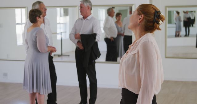 Middle-aged adults socializing in dance studio - Download Free Stock Images Pikwizard.com