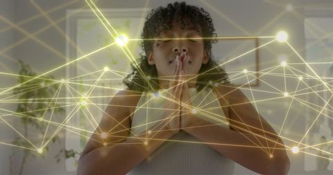 Teenage Girl Meditating with Abstract Glowing Network Overlay