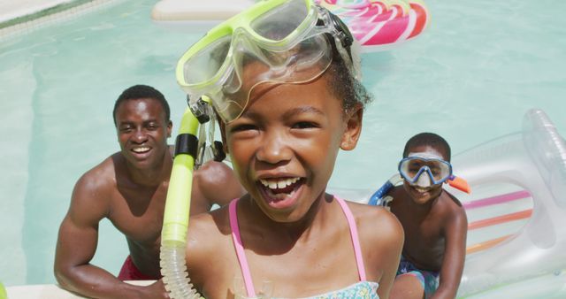 Family Enjoying Pool Day with Snorkeling Gear and Inflatable Toys - Download Free Stock Images Pikwizard.com