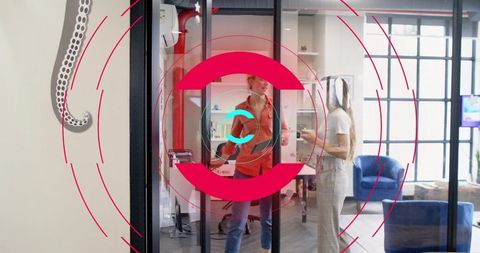 Women collaborating in modern glass meeting room with red cyan circular overlay