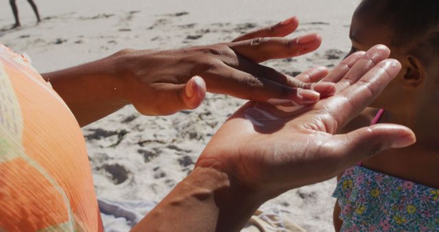 Parent Applying Sunscreen to Child at the Beach - Download Free Stock Images Pikwizard.com