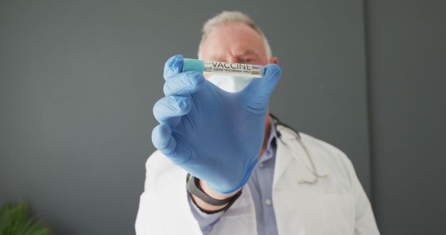 Doctor Holding COVID-19 Vaccine Vial Close Up - Download Free Stock Images Pikwizard.com