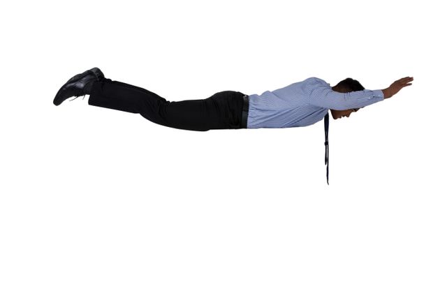 Businessman in formal attire appearing to fly in mid-air against a white background. Ideal for concepts related to success, innovation, creativity, and freedom in the corporate world. Can be used in marketing materials, advertisements, and presentations to symbolize out-of-the-box thinking and professional achievement.