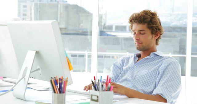Young Professional Relaxing in Modern Office Environment - Download Free Stock Photos Pikwizard.com