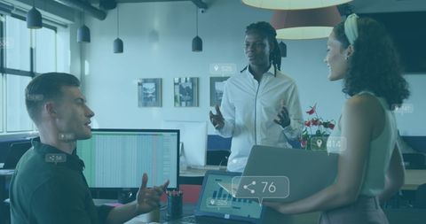 Diverse coworkers discussing digital growth in modern office
