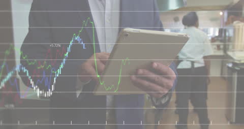 Businessman Analyzing Digital Data on Tablet with Graph Overlay