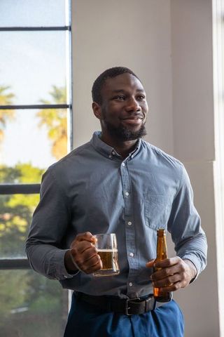 Man Relaxing with Beer in Contemporary Urban Lounge Setting