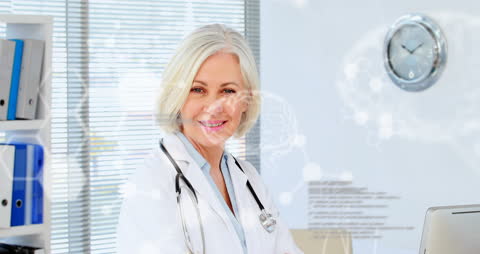 Senior Doctor Smiling in Digital Healthcare Environment