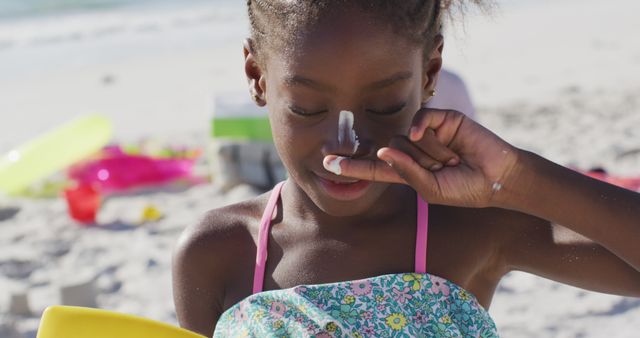 Joyful Girl Applying Sunscreen at Sunny Beach - Download Free Stock Images Pikwizard.com