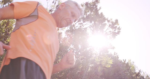 Senior Man Jogging Outdoors on Sunny Day - Download Free Stock Images Pikwizard.com