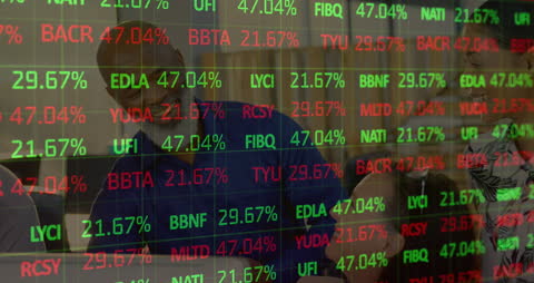 Team Collaborating Behind Dynamic Digital Stock Market Display