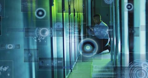 Kneeling IT technician checking tablet in data center with holographic HUD over server racks