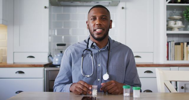 Male Doctor Giving Online Medical Advice from Kitchen Table - Download Free Stock Images Pikwizard.com