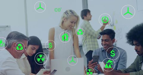 Diverse team discussing sustainable innovations with eco icons