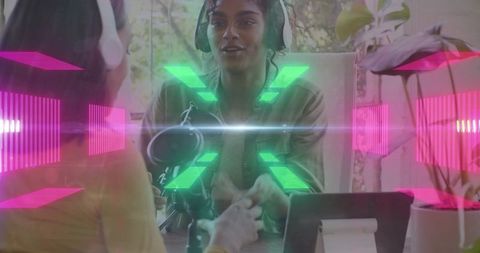 Two hosts recording energetic podcast conversation with neon sound visuals and studio gear